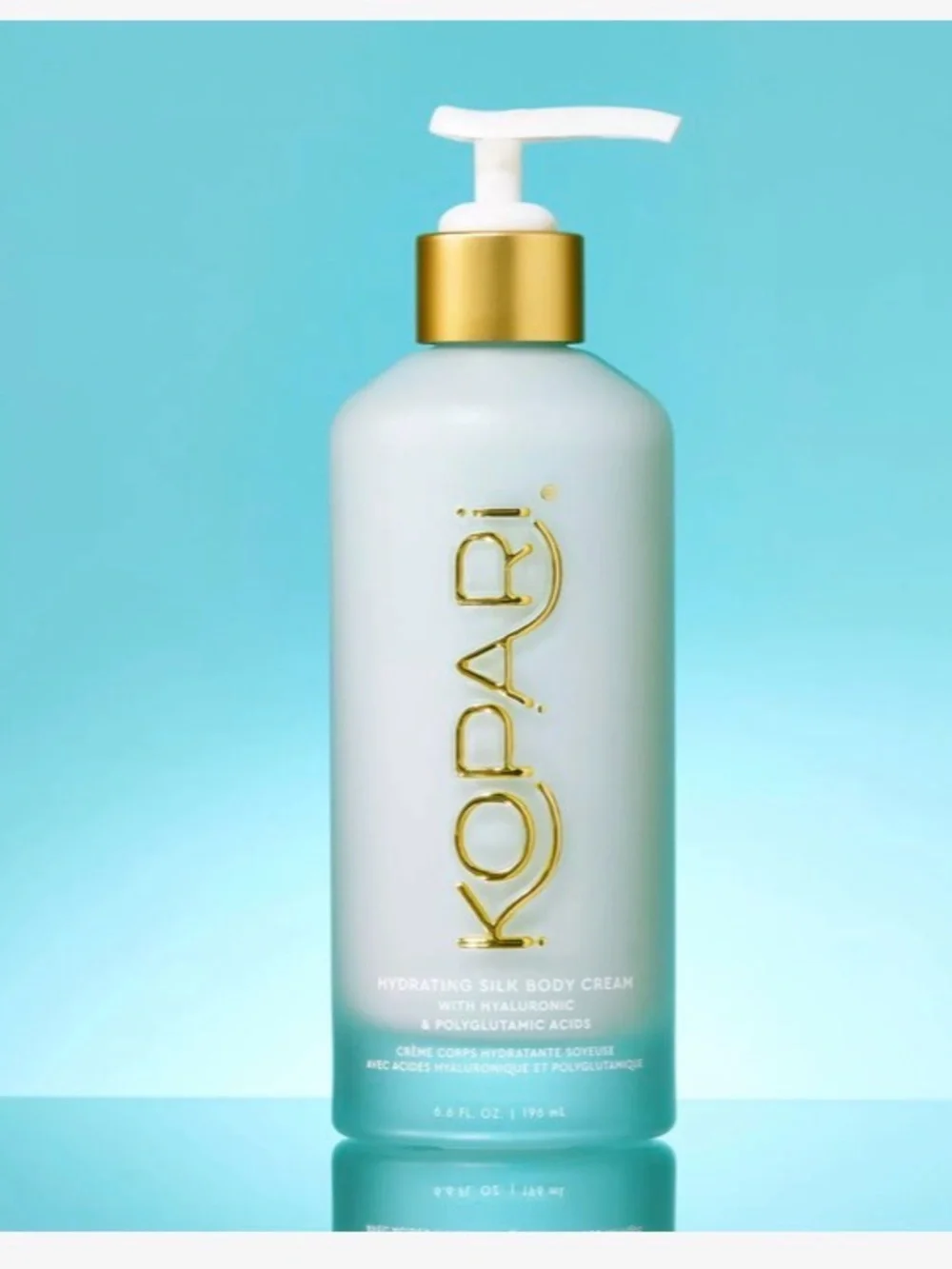Kopari Hydrating Silk Body Cream — Aqua Bottle with Gold Accents